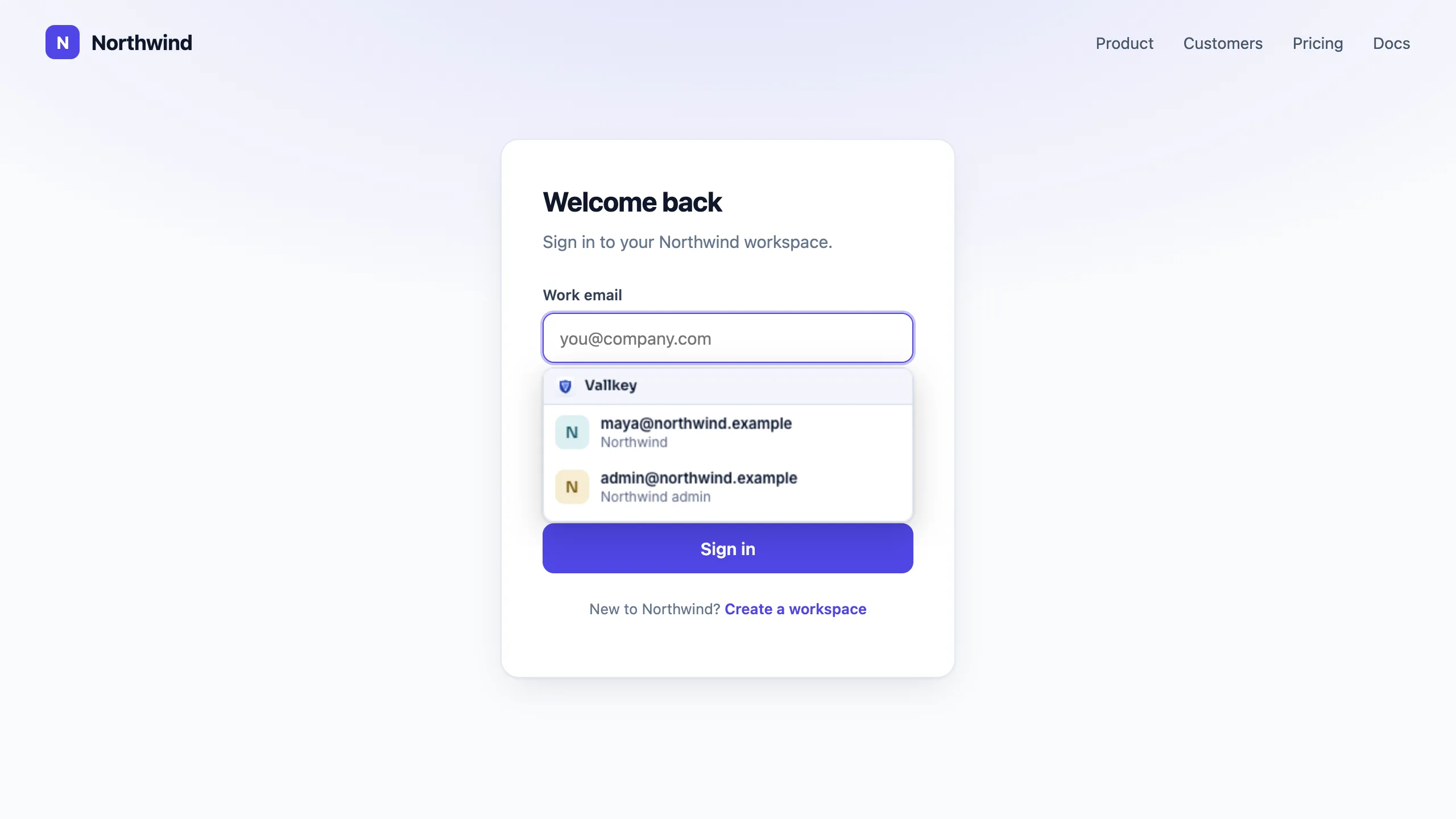 A company's sign-in page in the browser, with Vautir's menu under the email field offering two saved logins.